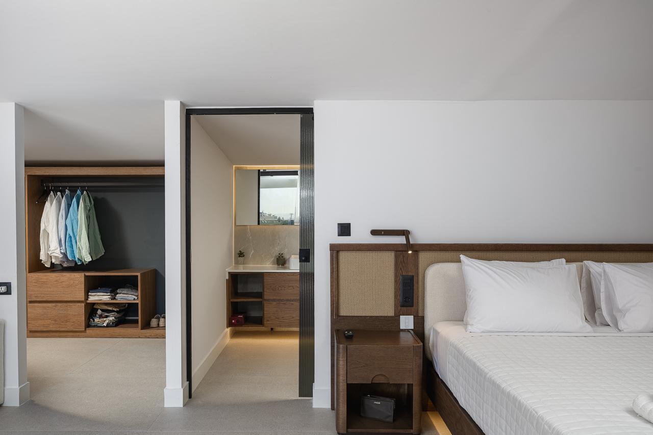 Walk-in dressing room and ensuite entry in the primary suite