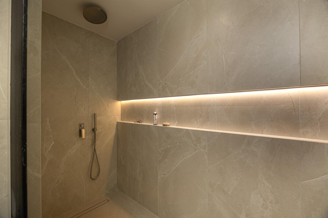 Backlit marble walk-in rain shower