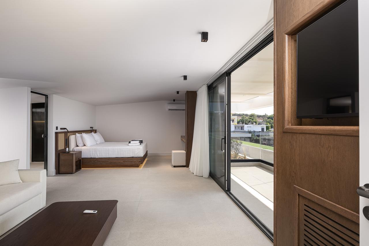 The primary suite with its own lounge and terrace beyond