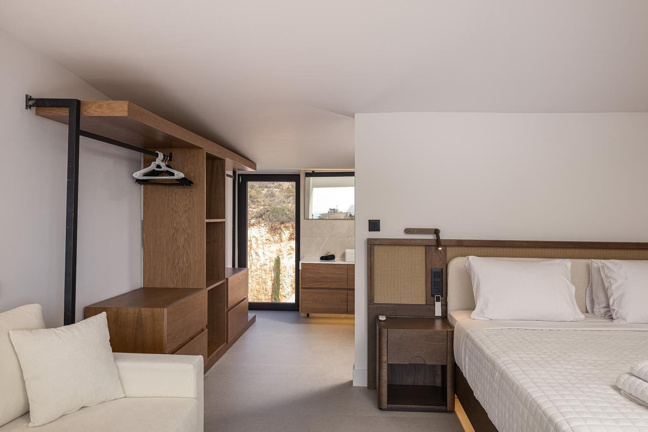 Open oak dressing area beside the bed